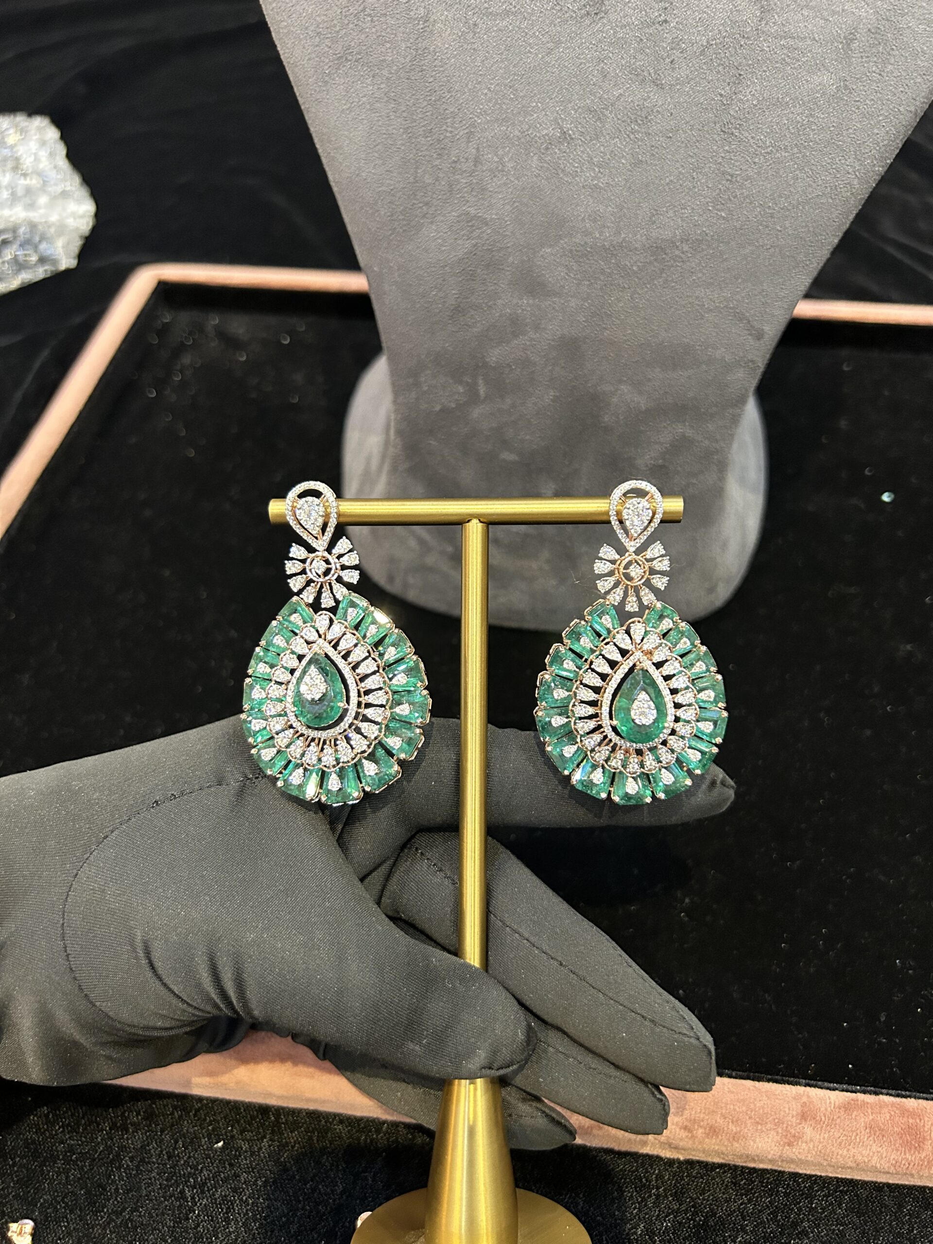 Elegant green gemstone earrings displayed